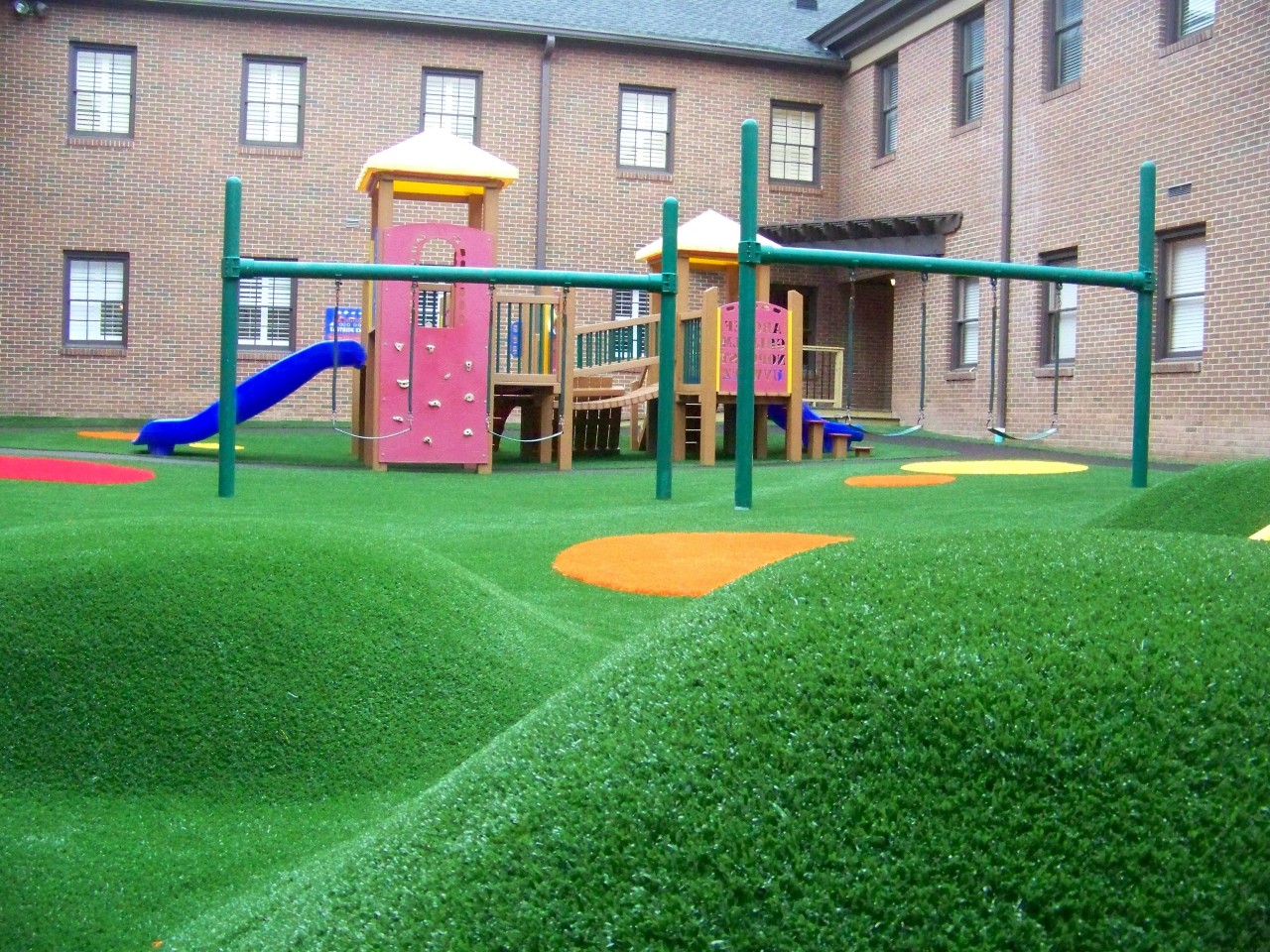 Hilly artificial turf playground by Southwest Greens of Western Canada
